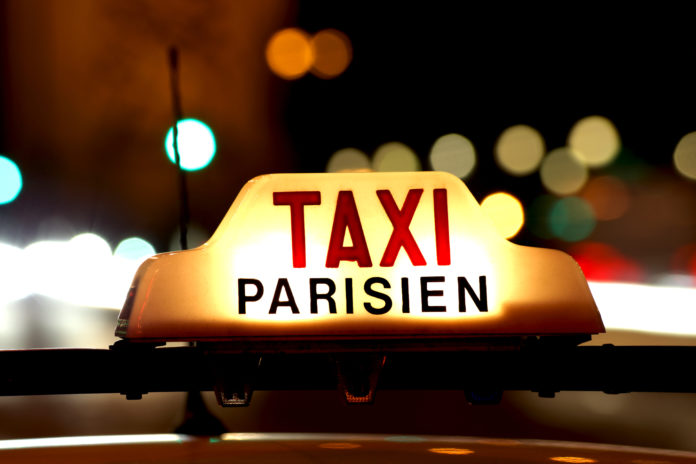 How do you catch a taxi in Paris?