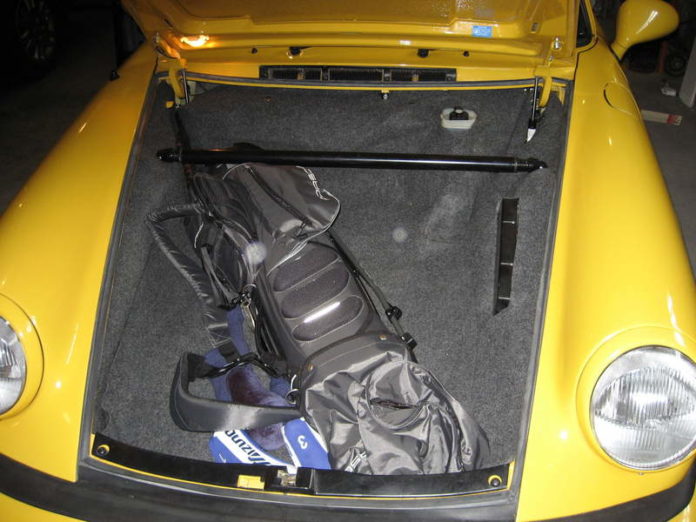 How do you transport golf clubs in a car?