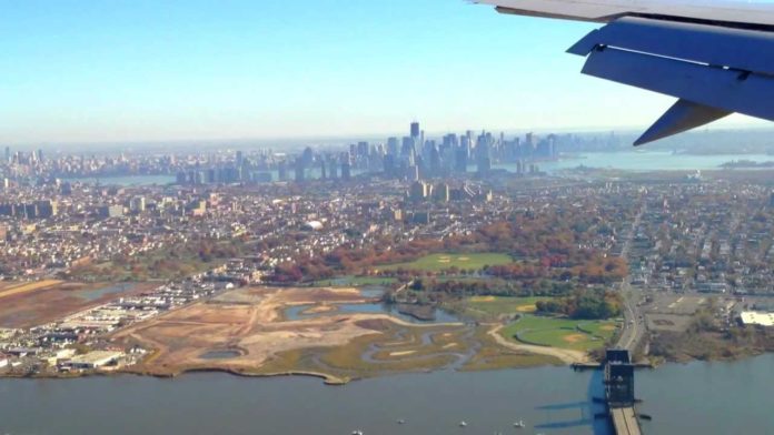 Is EWR or JFK closer to Manhattan?
