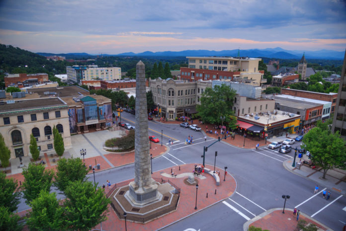 Is it better to stay in Biltmore Village or downtown Asheville?