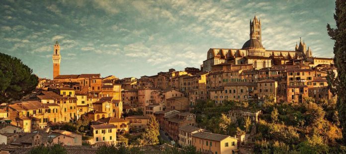 Where do you fly into to go to Tuscany Italy?